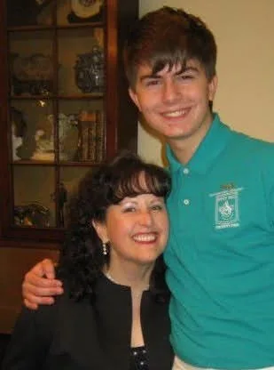 David at eighteen with the same music teacher, eight years later.